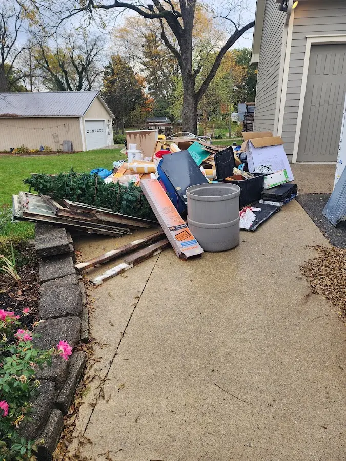 Dumpster being loaded with debris for Estate Cleanout Dumpster Rental in Rhinebeck